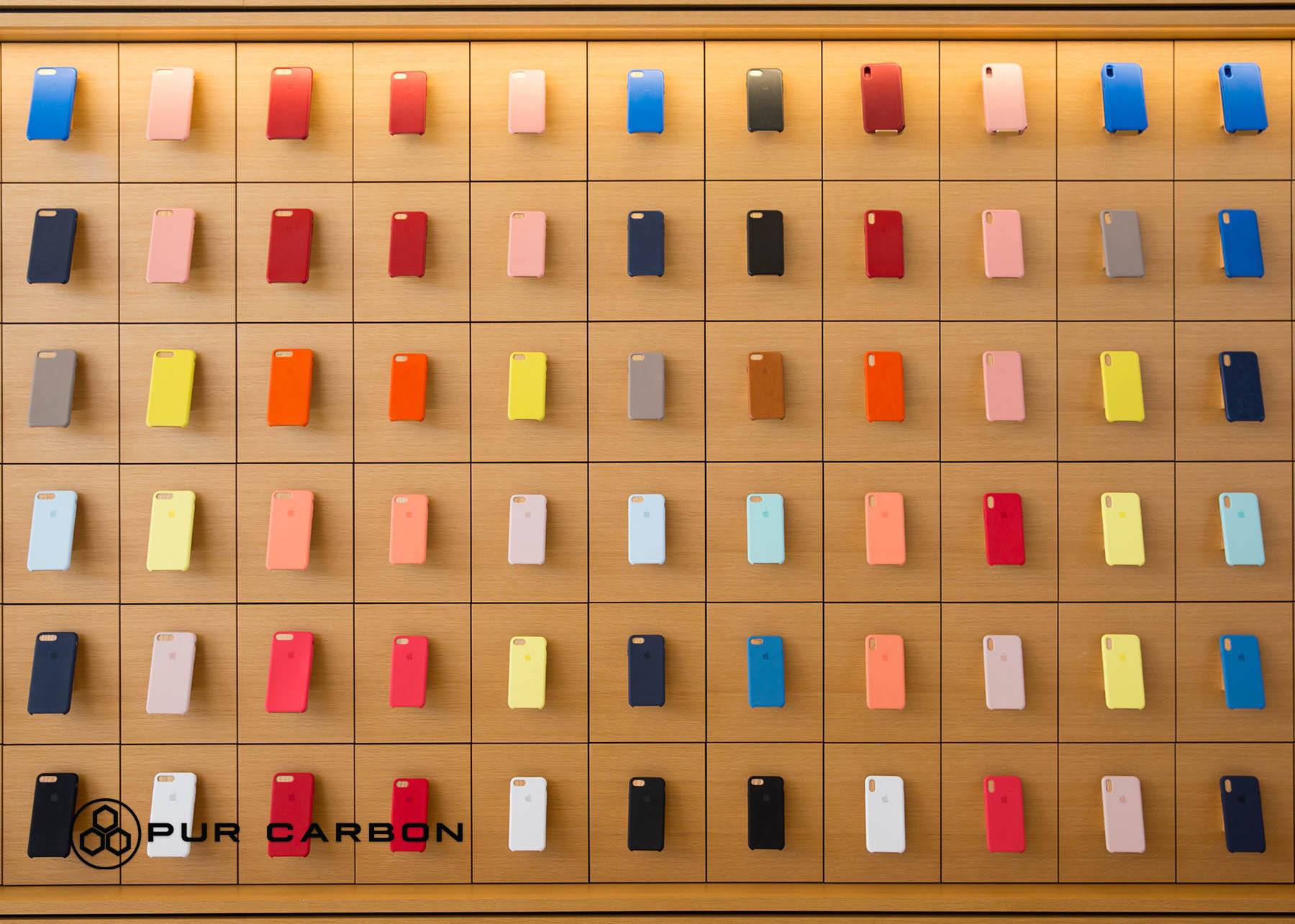 iPhone cases displayed on a wall for customers to choose from